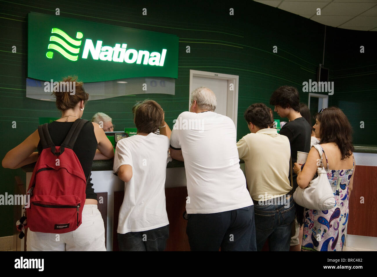 People at a National car rental desk, Las Vegas airport, Las Vegas Nevada USA Stock Photo