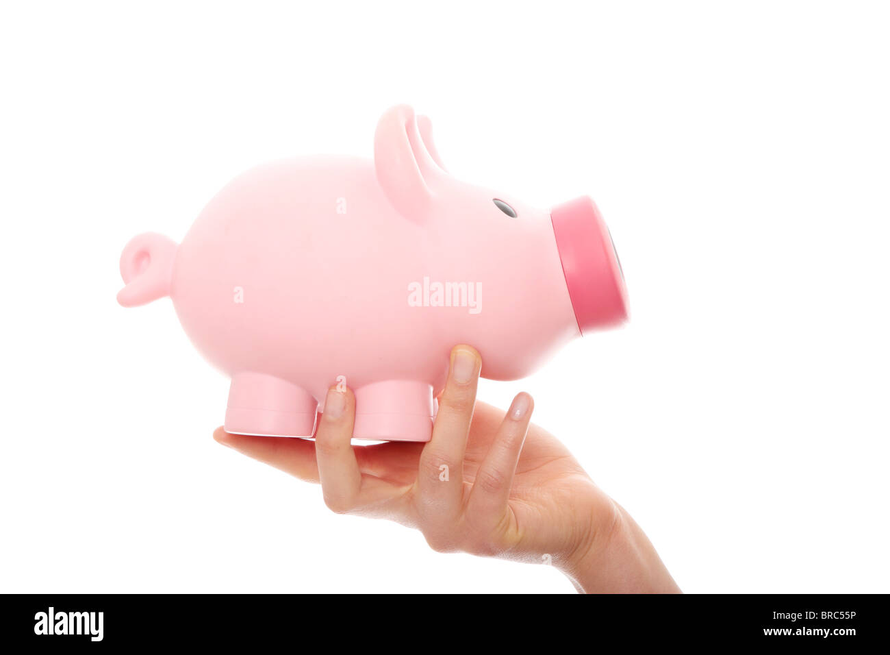 A woman hand holding a piggy bank. Isolated on white Stock Photo - Alamy