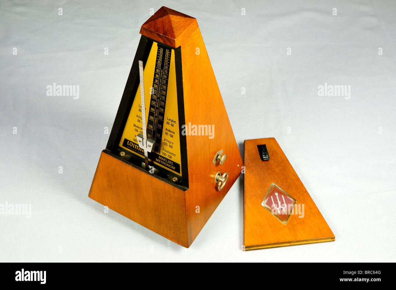 An old fashion wooden metronome. Stock Photo