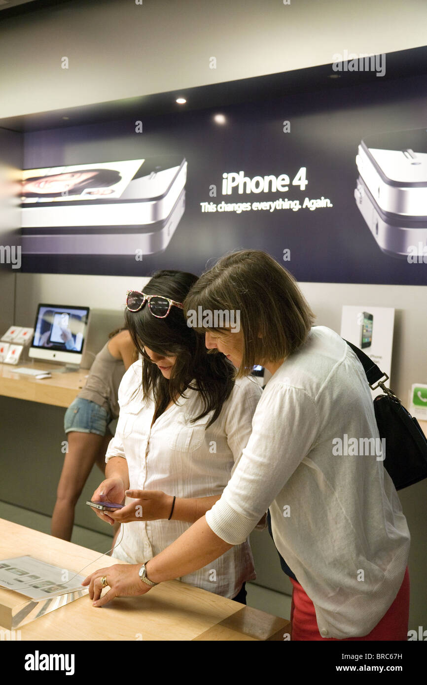 People trying out the iphone at the Apple Store, Fashion Show Mall, Las ...