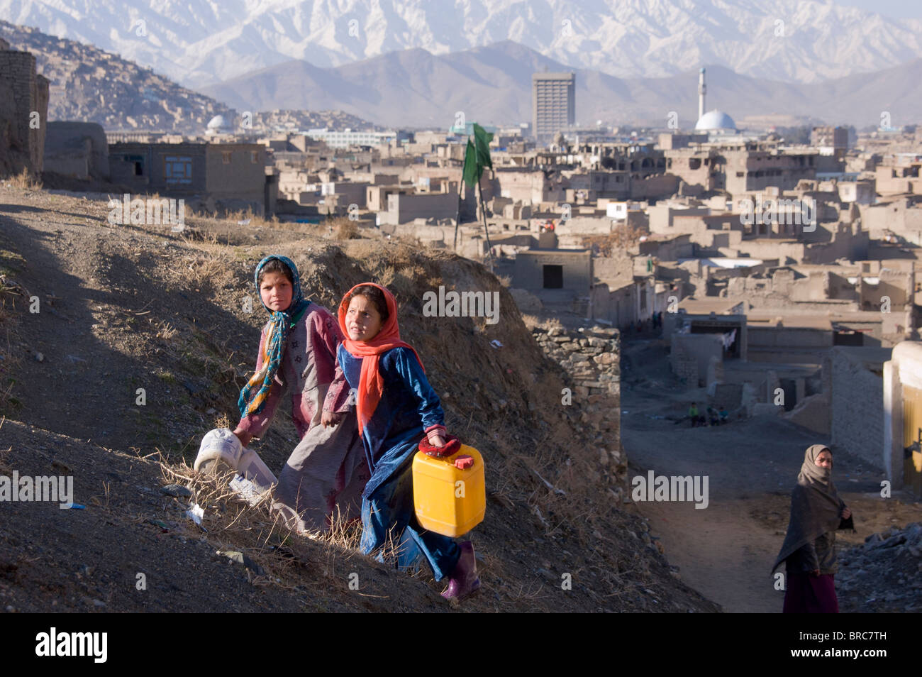 Girls collect water in Kabul Afghanistan Stock Photo