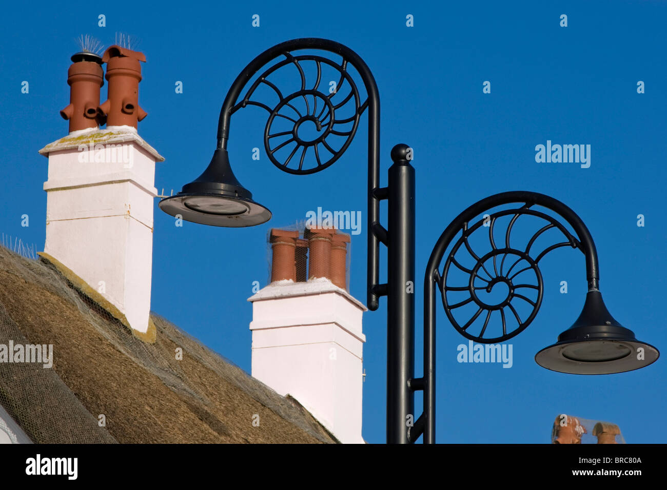 Chimneys and ammonite lamp posts in Lyme Regis Stock Photo