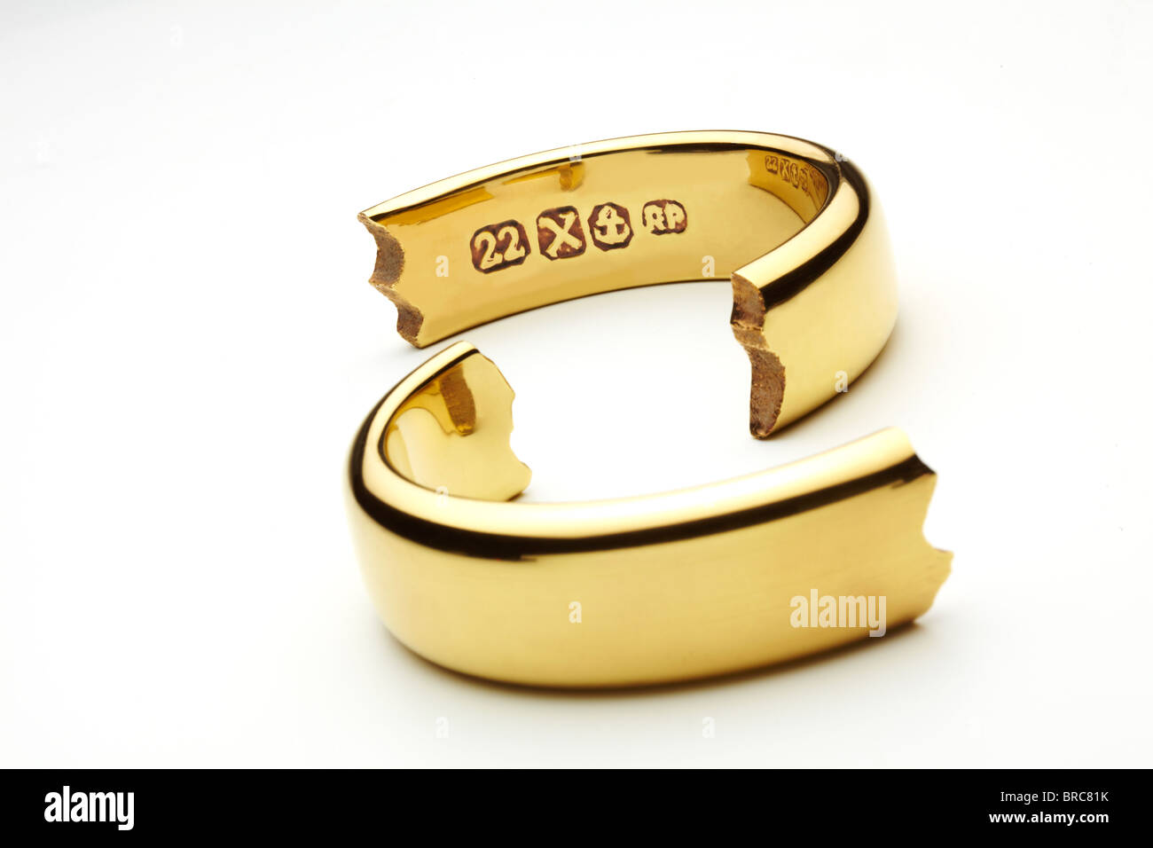 Broken Gold Wedding Ring Symbolizing Marriage Break Up Stock Photo Alamy