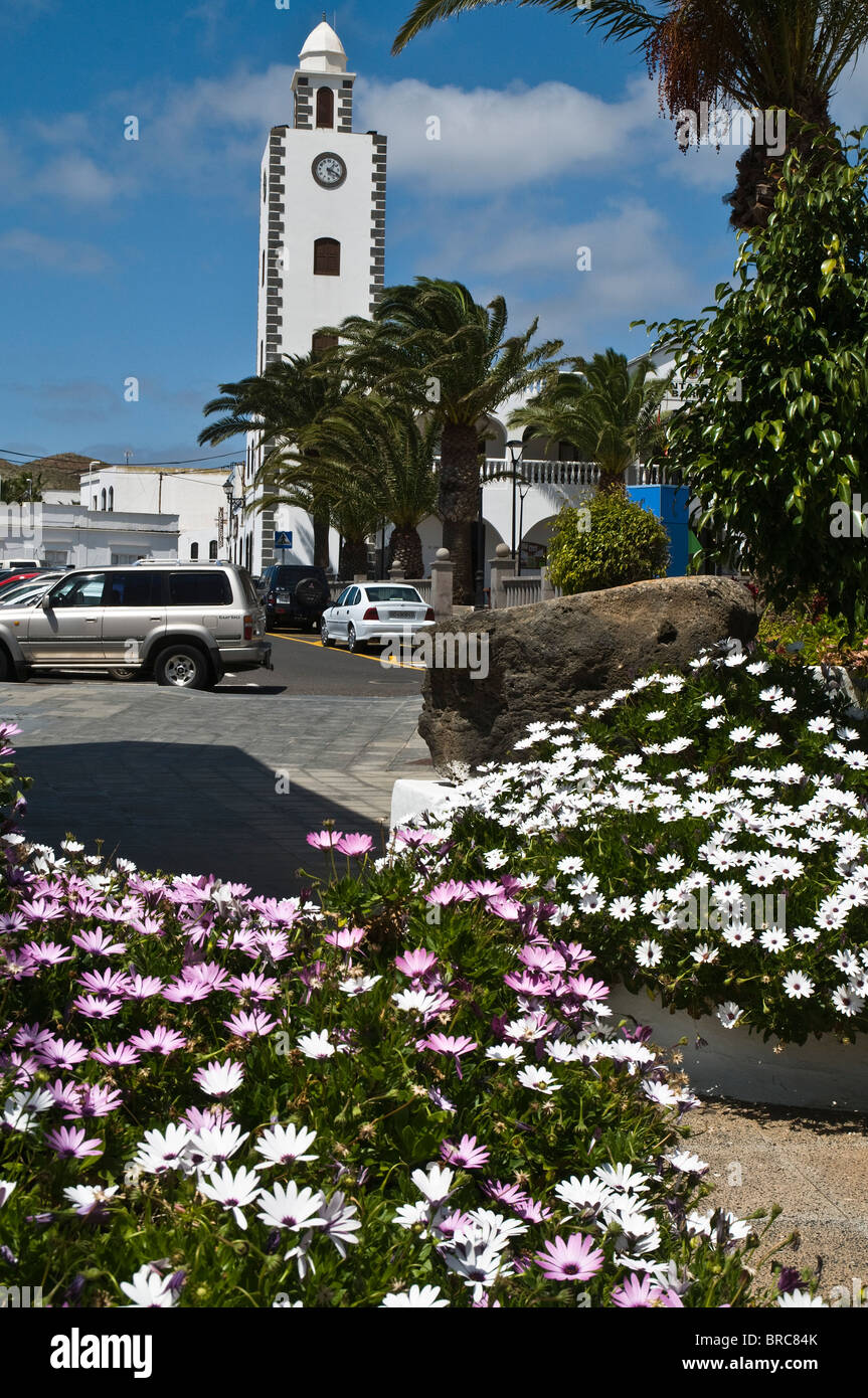 dh  SAN BARTOLOME LANZAROTE Clock tower white building and village flower display Stock Photo