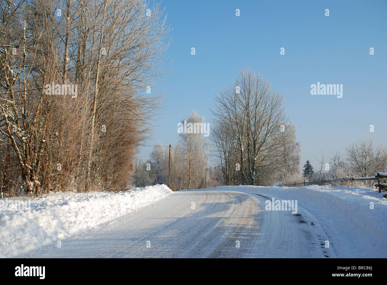 Small road in winter landscape Stock Photo