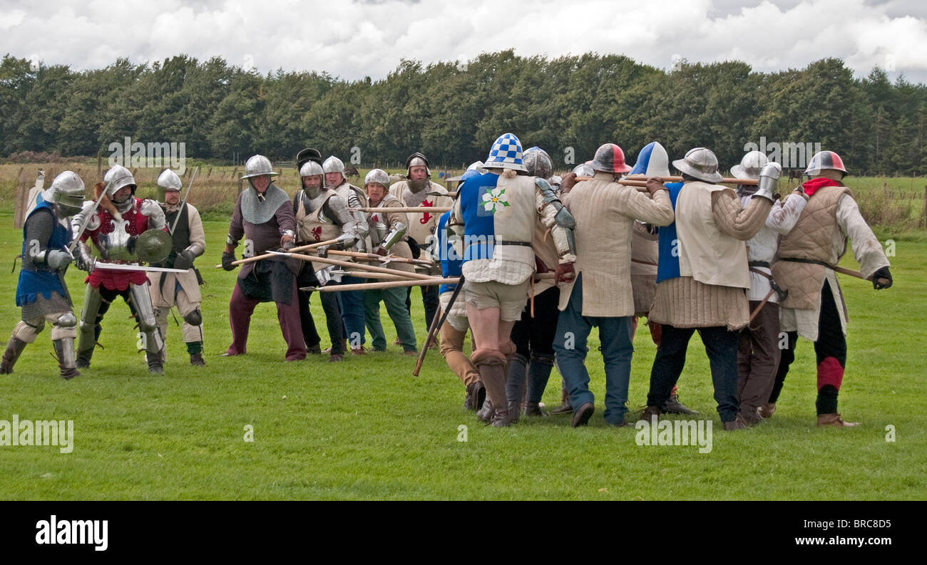 Soldiers charging towards each other with weapons, Medieval Festival, Lanark, Lanarkshire, Scotland, UK, Western Europe. Stock Photo