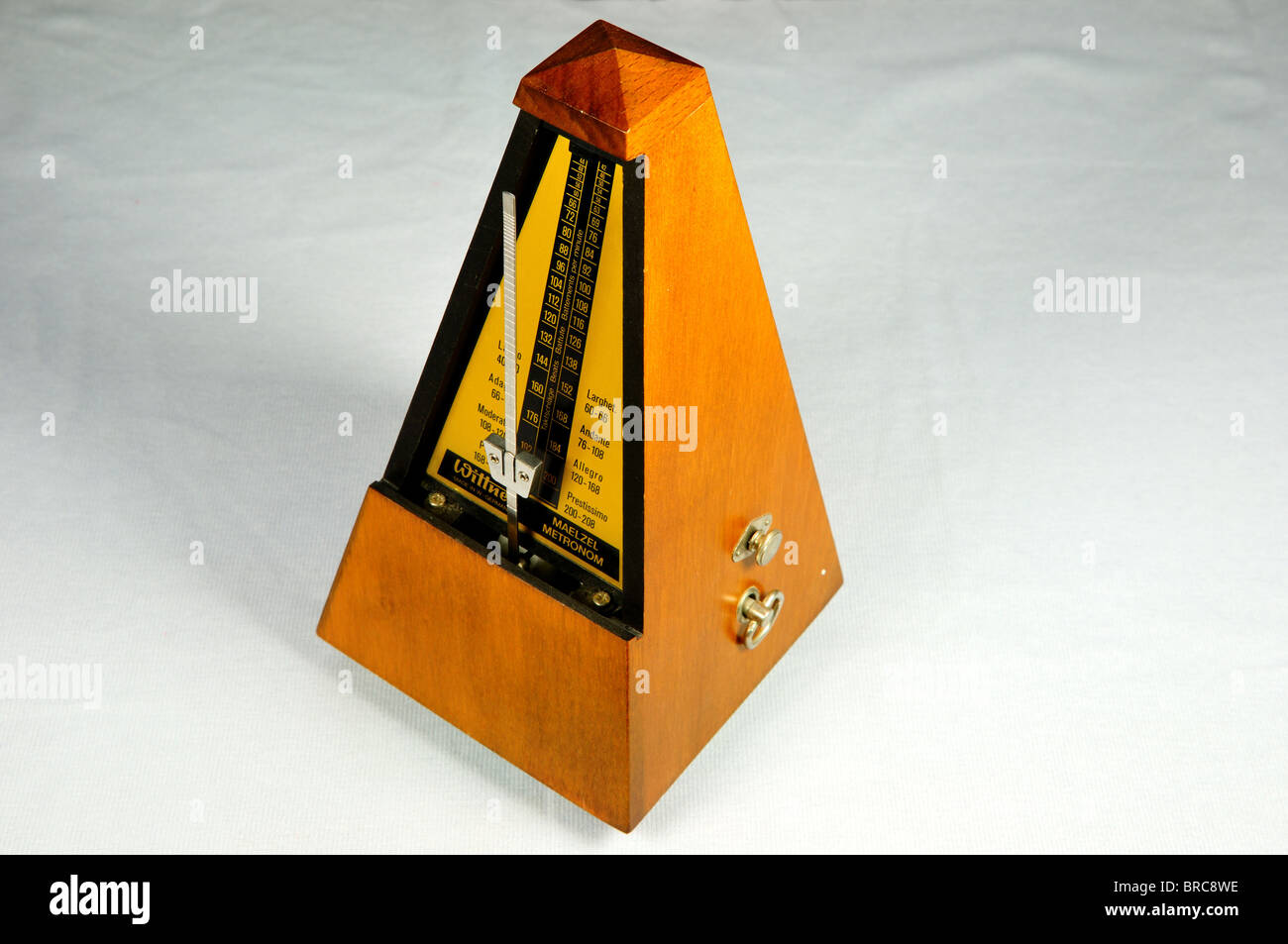 An old fashion wooden metronome. Stock Photo