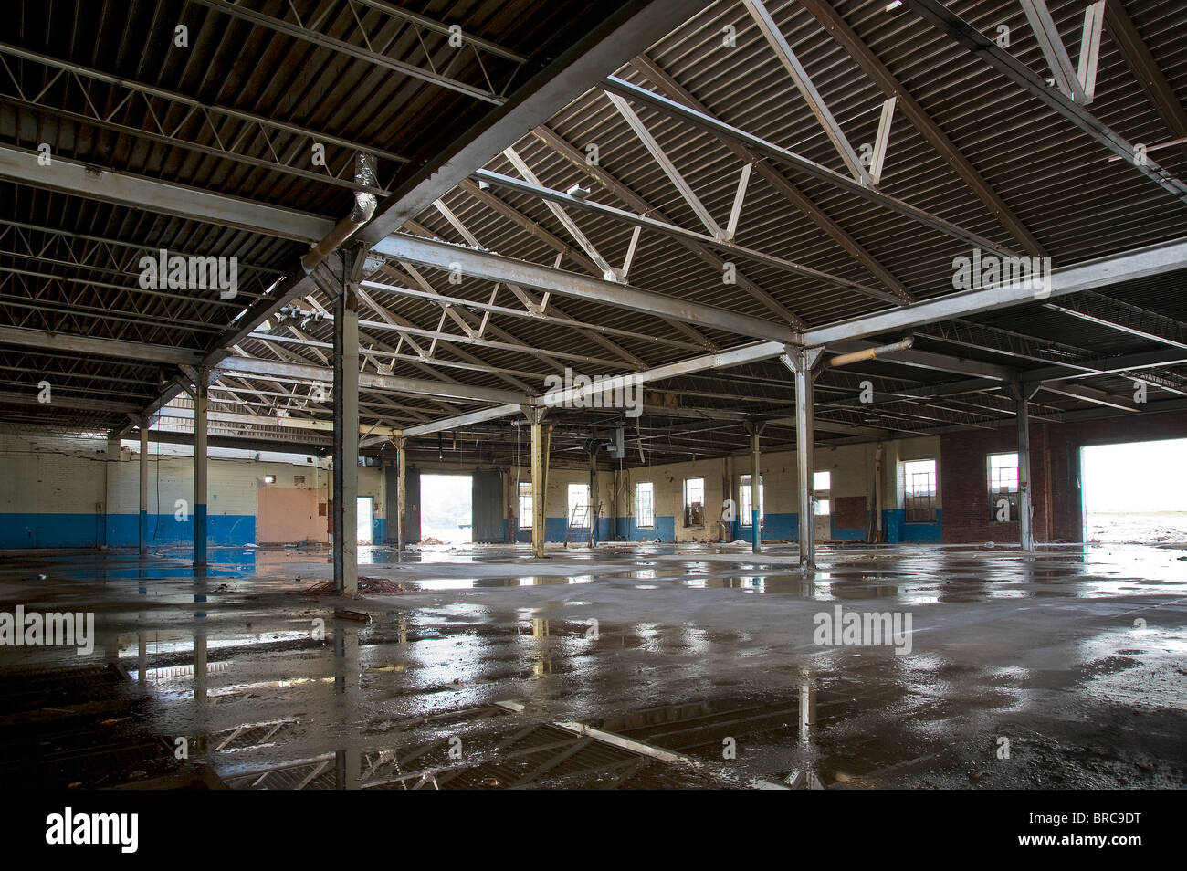 Abandoned Old Industrial Building With Puddles Of Water On Floor, Philadelphia, USA Stock Photo