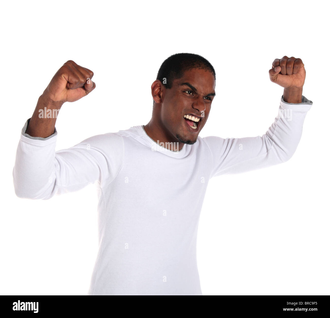 An attractive dark-skinned man cheering. All on white background. Stock Photo