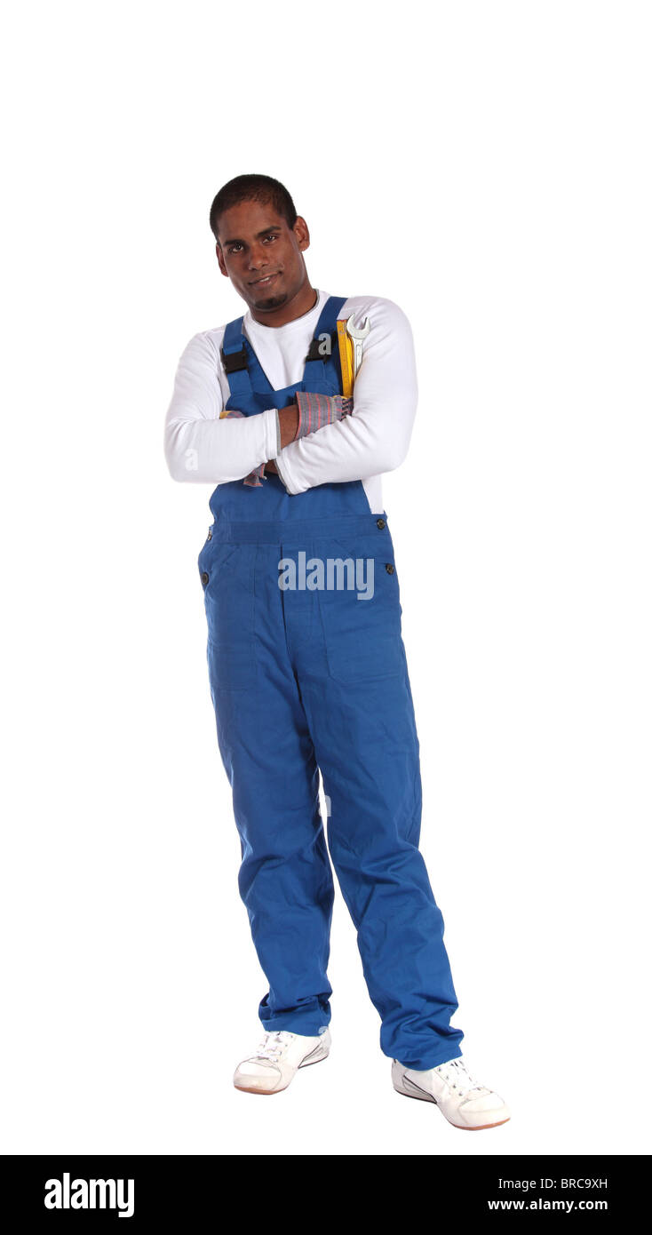 An ambitious dark-skinned worker standing. All on white background. Stock Photo