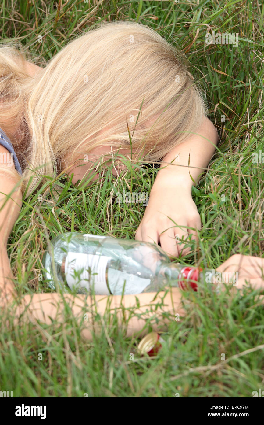 Teen alcohol addiction (drunk teen with vodka bottle Stock Photo