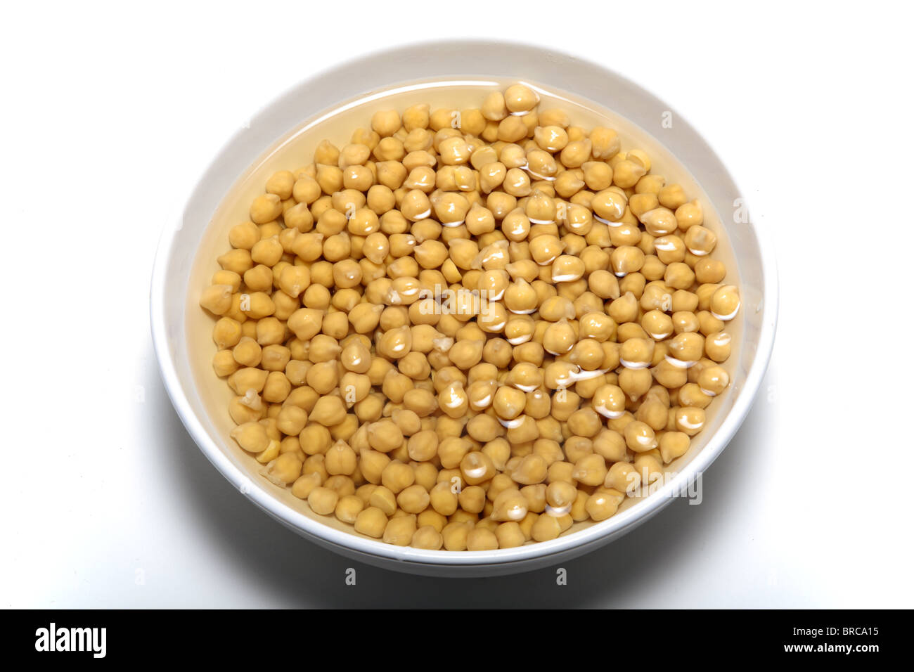 Chickpeas soaking in water. Stock Photo