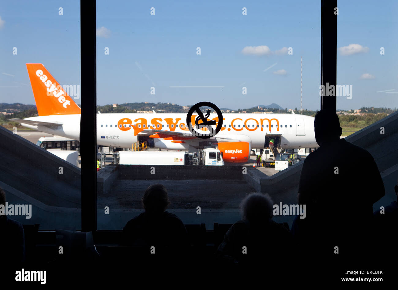 Passengers wait in Departure Lounge for EasyJet flight at Corfu Airport. Stock Photo
