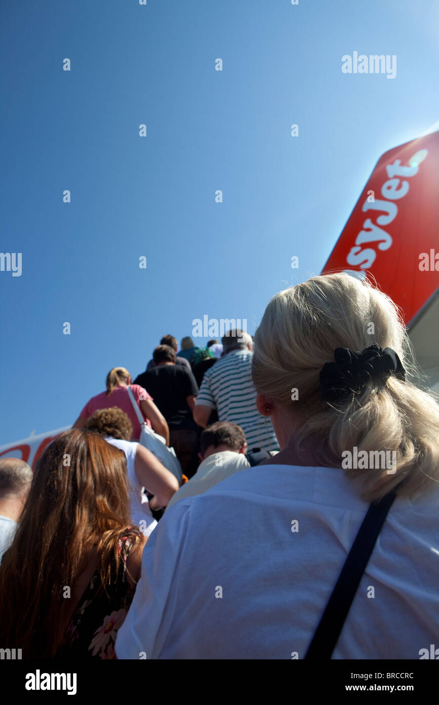 Passengers board an EasyJet flight at Corfu airport. Stock Photo