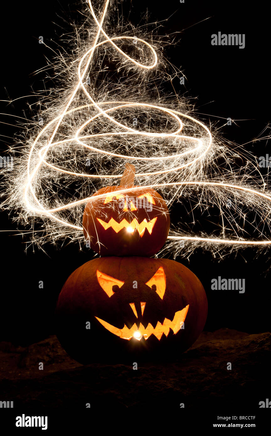 Halloween pumpkin, Jack o lantern, fire face and fireworks Stock Photo