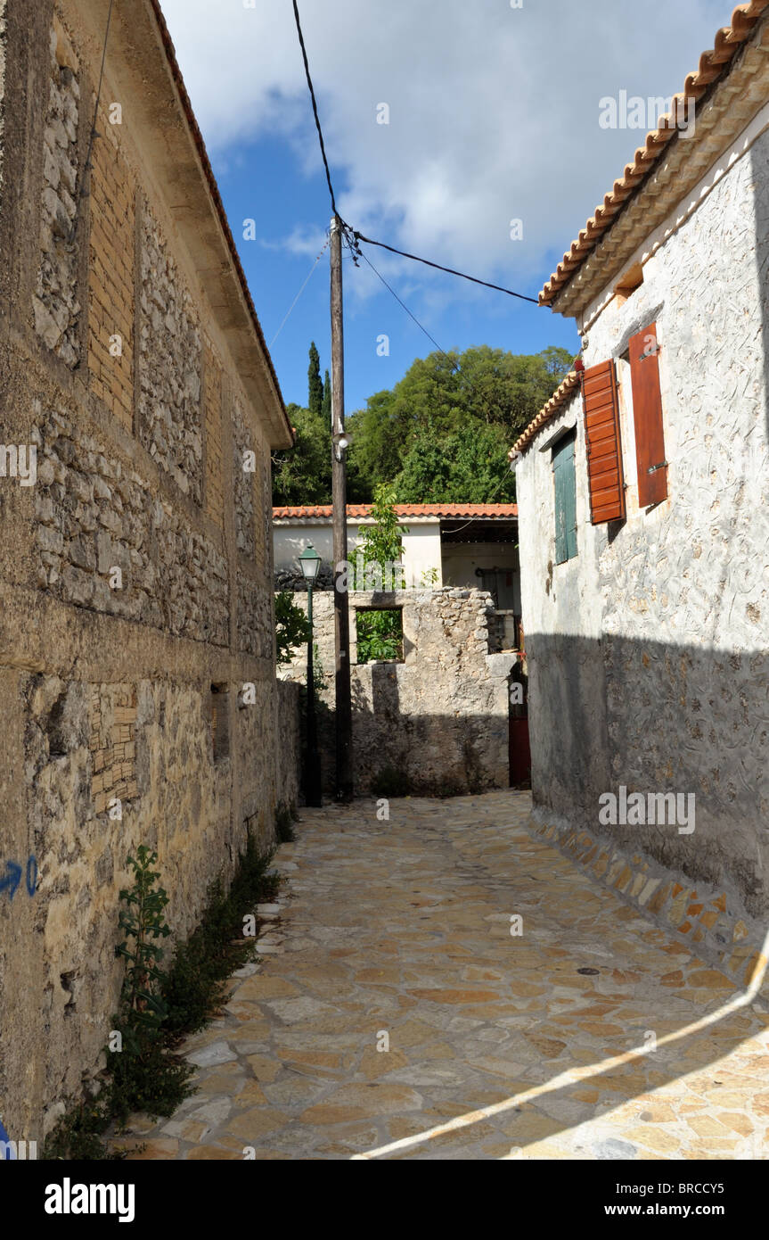 Narrow street and traditional houses in village Louha in the island of Zakynthos, Greece. Stock Photo