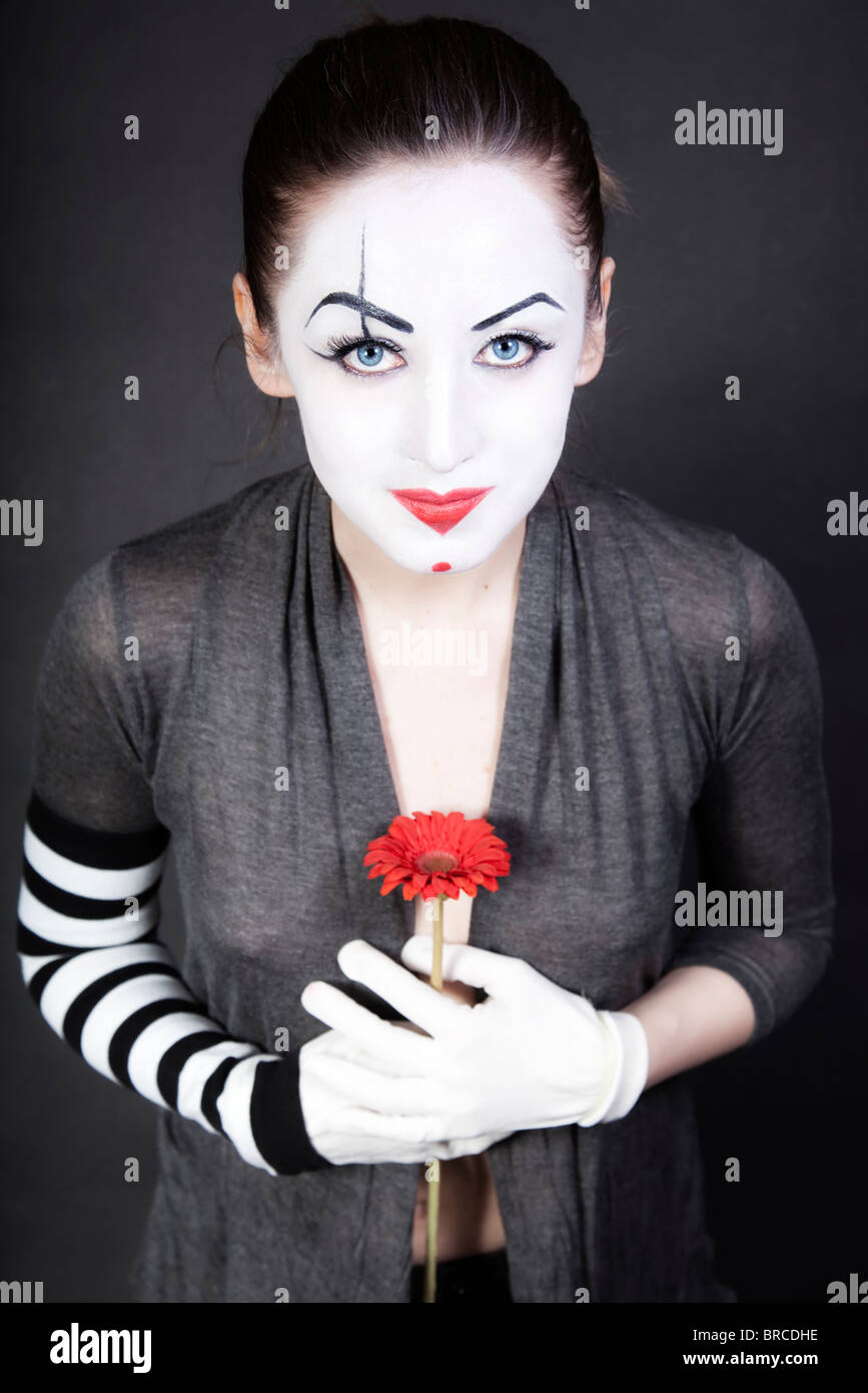 woman mime with red flower Stock Photo Alamy