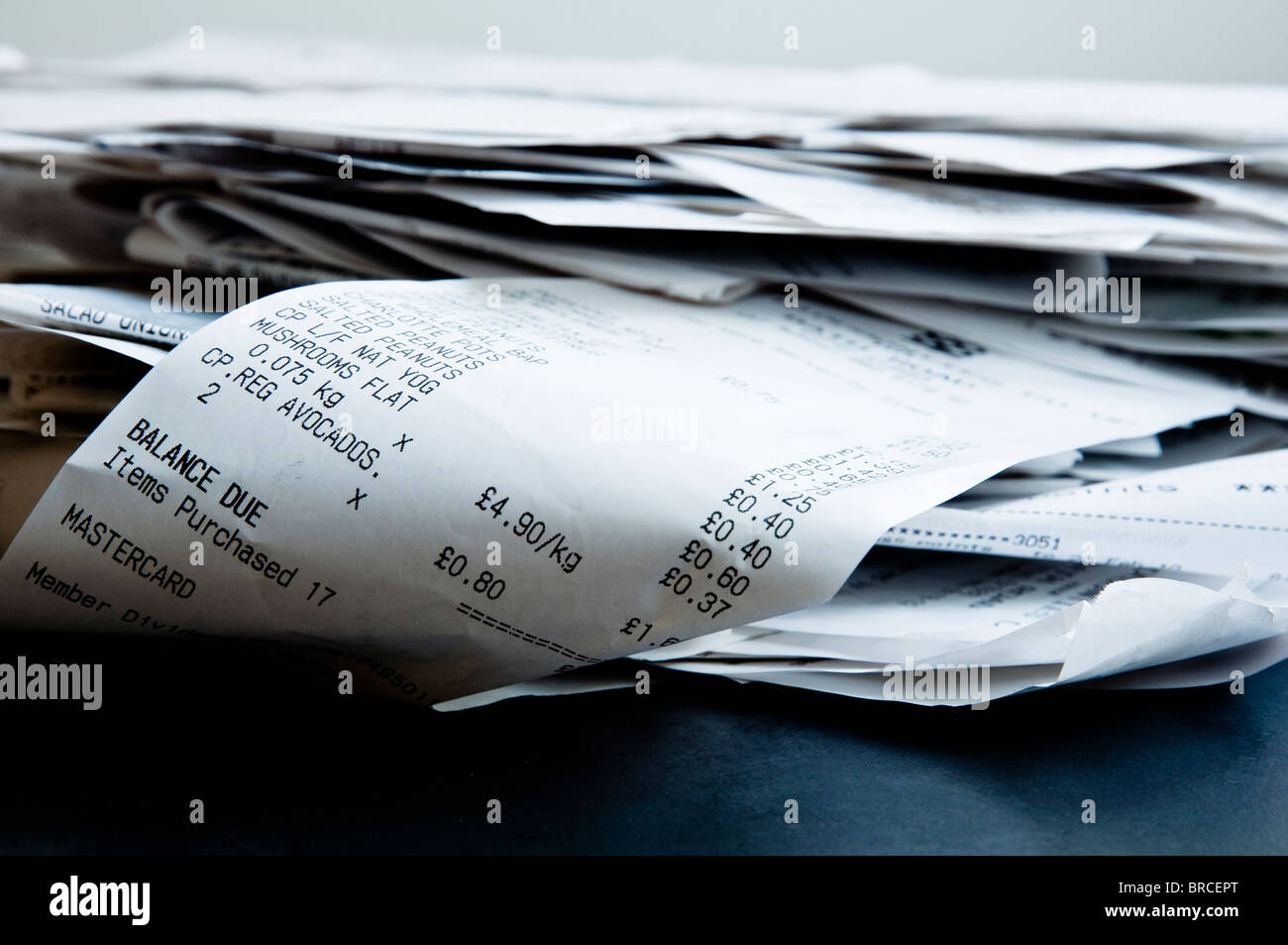 Pile of receipts for everyday living expenses. Stock Photo