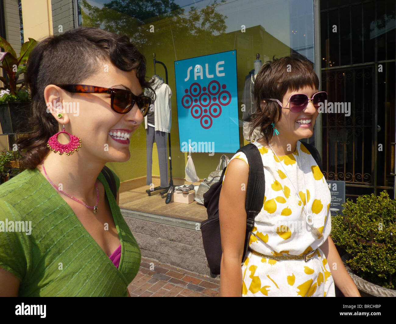 Two young smiling women shopping Stock Photo