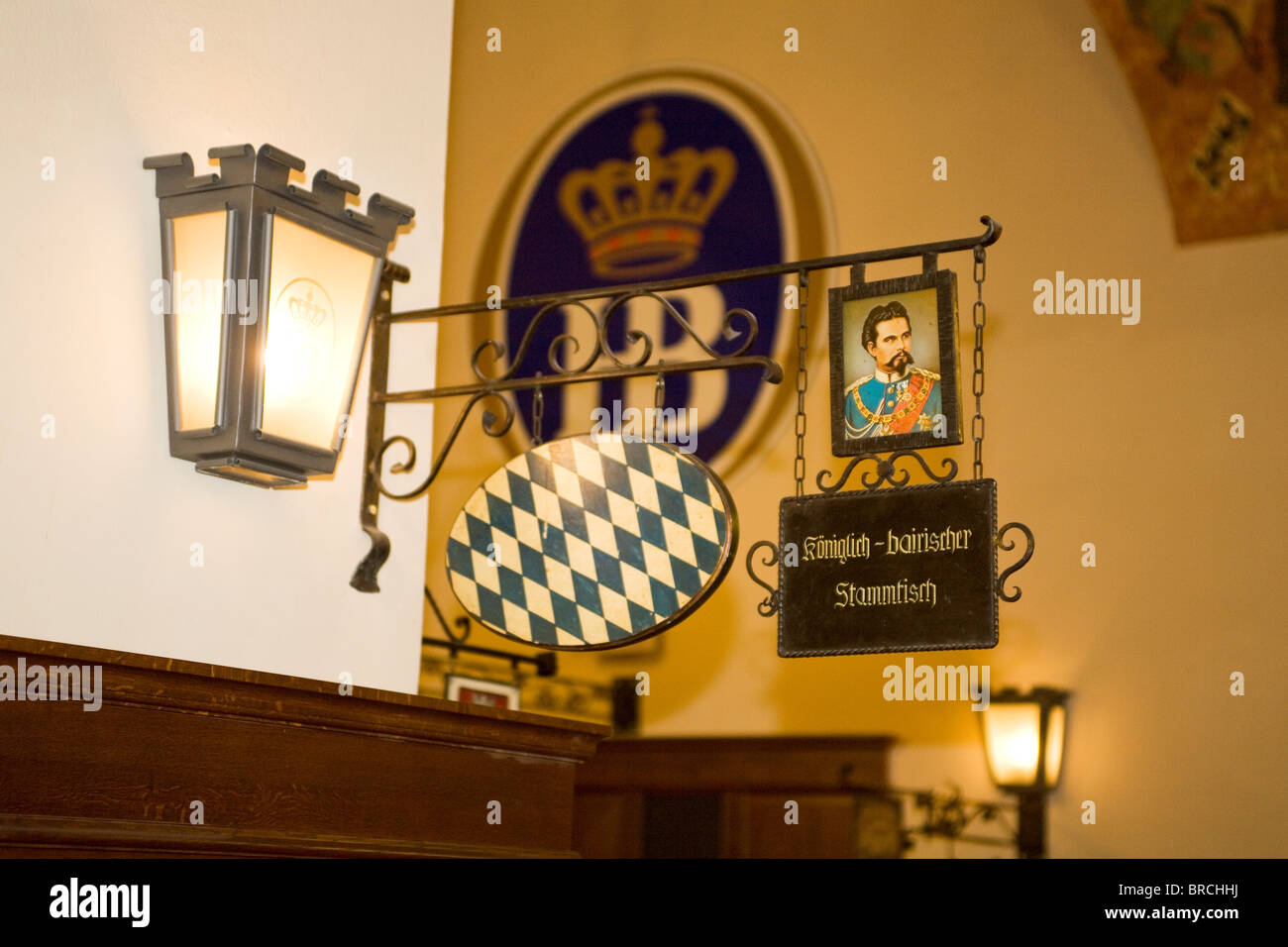 A sign denotes support for Bavarian royalty at a regulars' table (Stammtisch) in the Hofbraeuhaus in Munich, Germany. Stock Photo