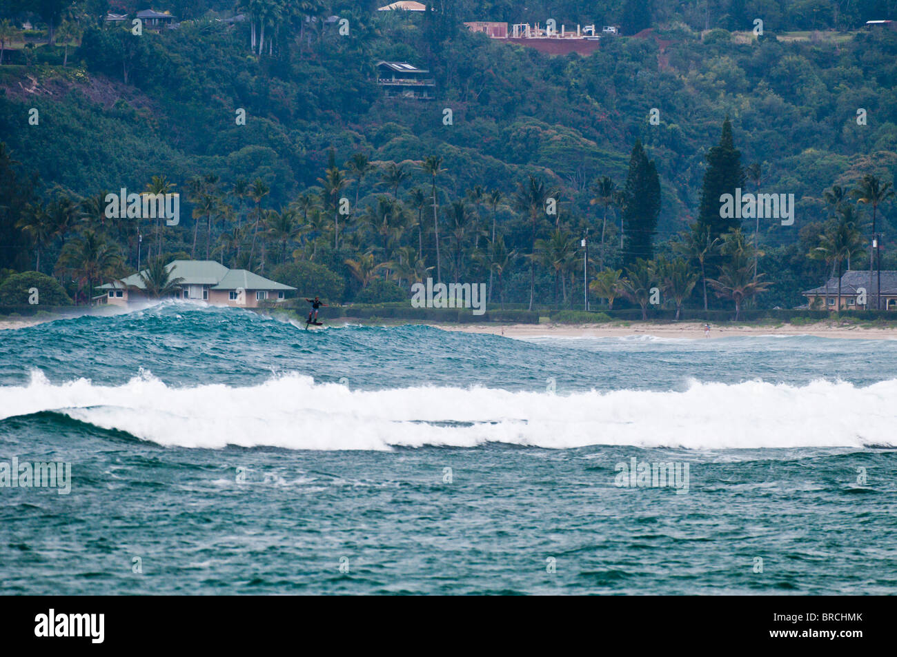 Laird Hamilton foil surfing in Hanalei Bay, Kauai, Hawaii Stock Photo