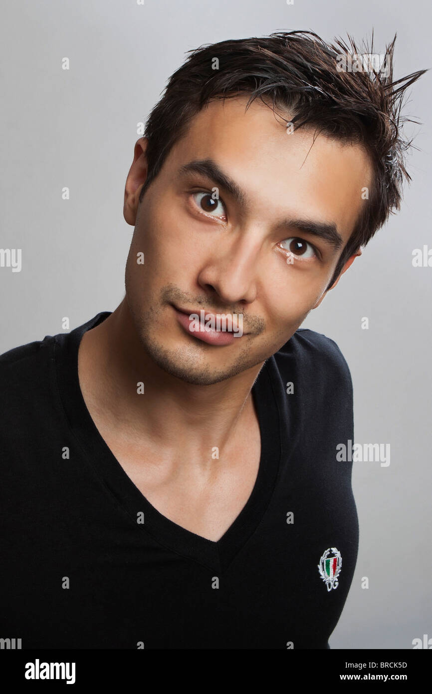 A studio portrait of a young man Stock Photo - Alamy