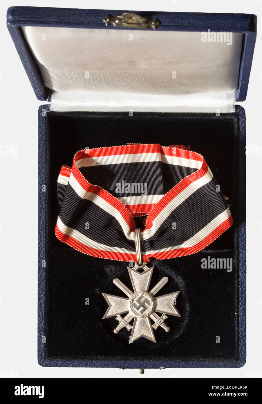 A Knight's Cross with Swords to the War Merit Cross of 1939, in its presentation case Frosted silver, the edges polished, closed, fluted suspension ring, punched '900' and '1' (for Deschler, Munich) on the lower cross arm. Unworn (Nie 7.04.03 1). Dimensions ca. 53 x 58 mm, weight 38.9 g. Sewn neck ribbon, length 49 cm. Blue award case with black velvet insert and silver coloured silk cover liner, the edges slightly rubbed. historic, historical, 1930s, 20th century, awards, award, German Reich, Third Reich, Nazi era, National Socialism, object, objects, stills, , Stock Photo