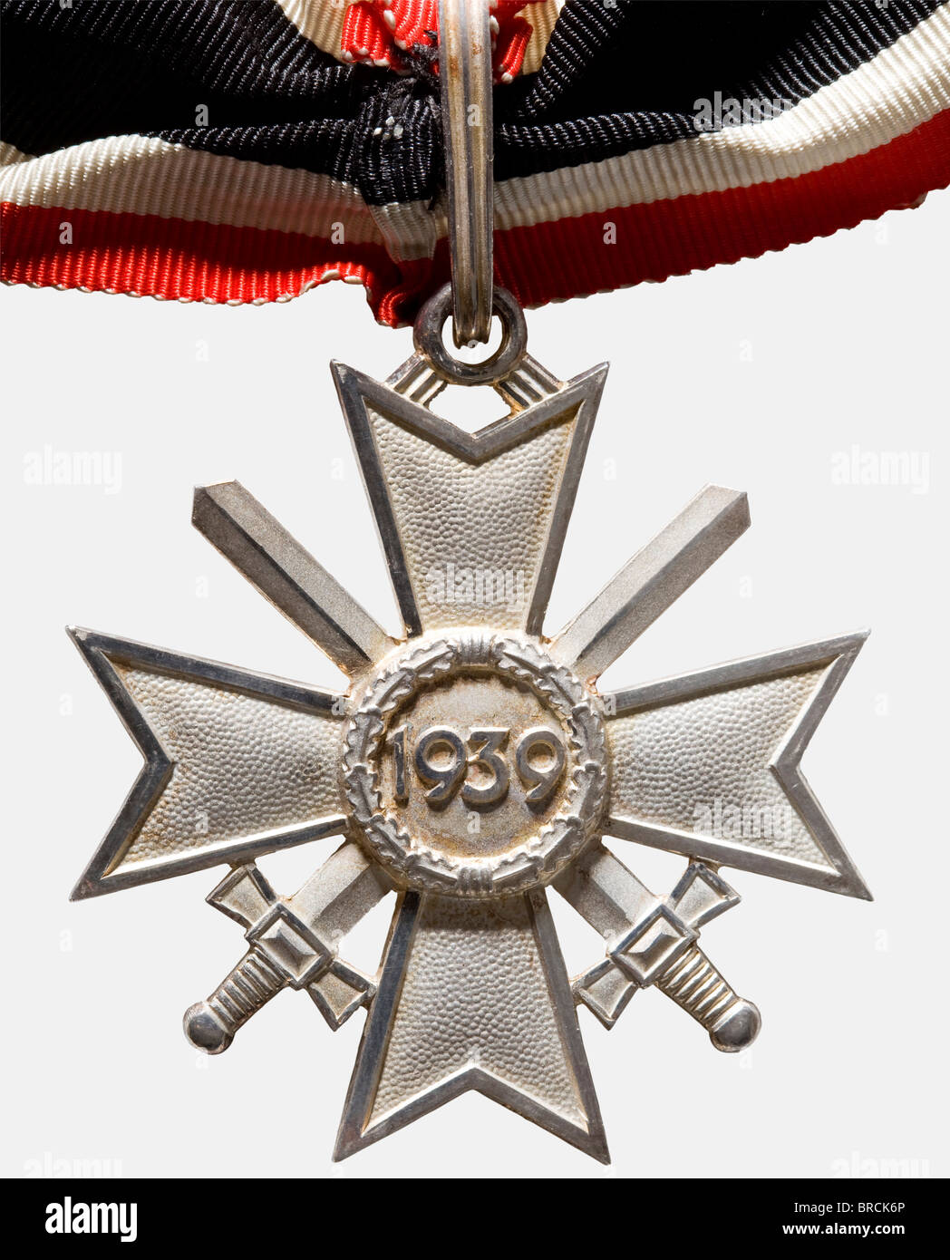 A Knight's Cross with Swords to the War Merit Cross of 1939, in its presentation case Frosted silver, the edges polished, closed, fluted suspension ring, punched '900' and '1' (for Deschler, Munich) on the lower cross arm. Unworn (Nie 7.04.03 1). Dimensions ca. 53 x 58 mm, weight 38.9 g. Sewn neck ribbon, length 49 cm. Blue award case with black velvet insert and silver coloured silk cover liner, the edges slightly rubbed. historic, historical, 1930s, 20th century, awards, award, German Reich, Third Reich, Nazi era, National Socialism, object, objects, stills, , Stock Photo
