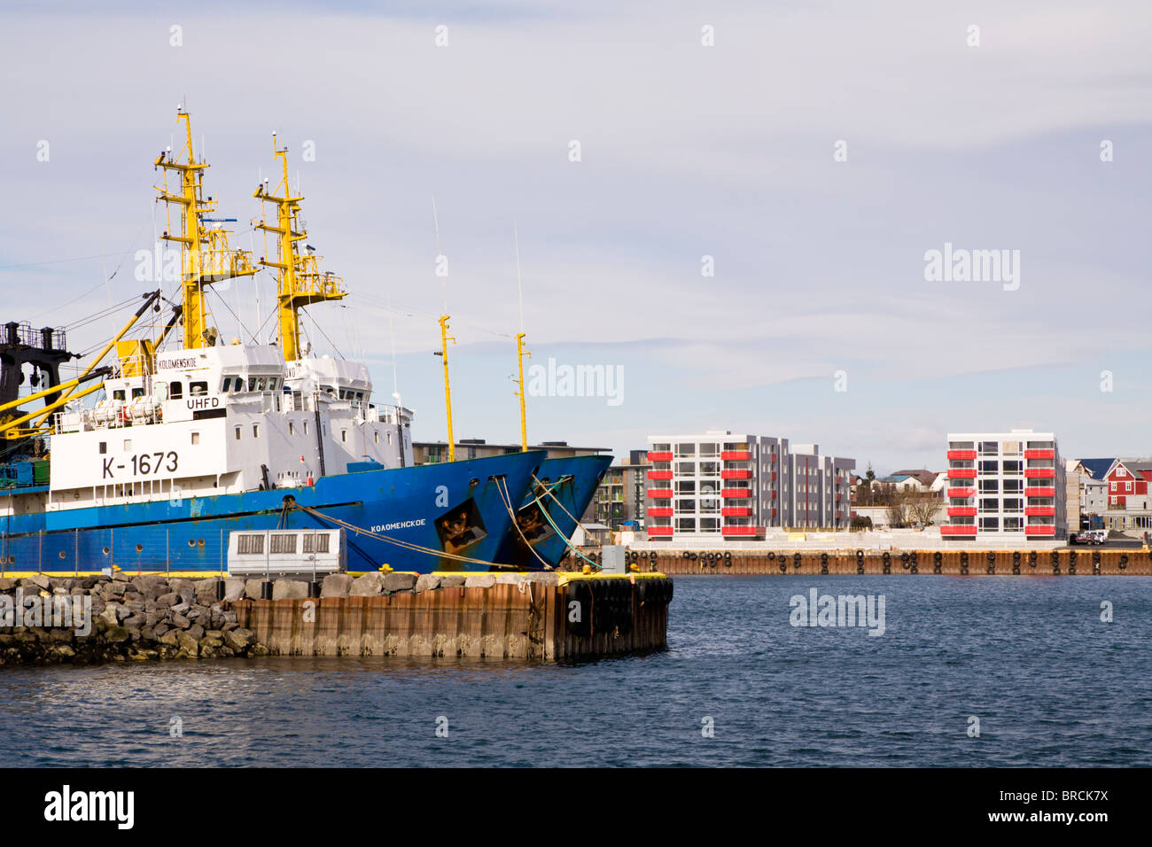 Trawlers and apartment blocks at the harbour, Hafnarfjordur, Greater Reykjavik Area, Iceland. Stock Photo