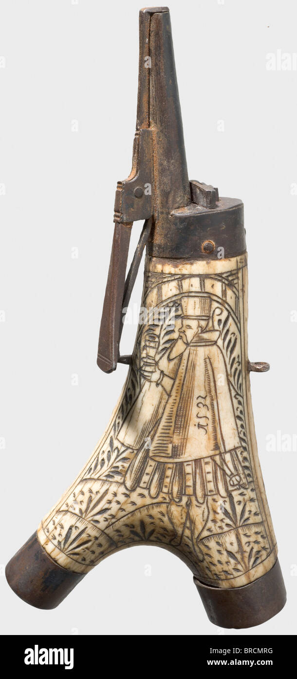 A German stag horn powder flask, dated 1532. Viewing side is engraved with a standing man in Renaissance garb, stylised grasses and the date '1532'. Natural-finish reverse. Iron, patinaed fittings with spring-loaded spout, reverse belt hooks and lateral suspension loops. Length 22 cm. A similarly engraved powder flask fragment is in the Army Museum Ingolstadt, In.-No. A 8467. historic, historical, 16th century, powder flask, accessory, accessories, military, militaria, object, objects, stills, utilities, utility, clipping, clippings, cut out, cut-out, cut-outs,, Stock Photo