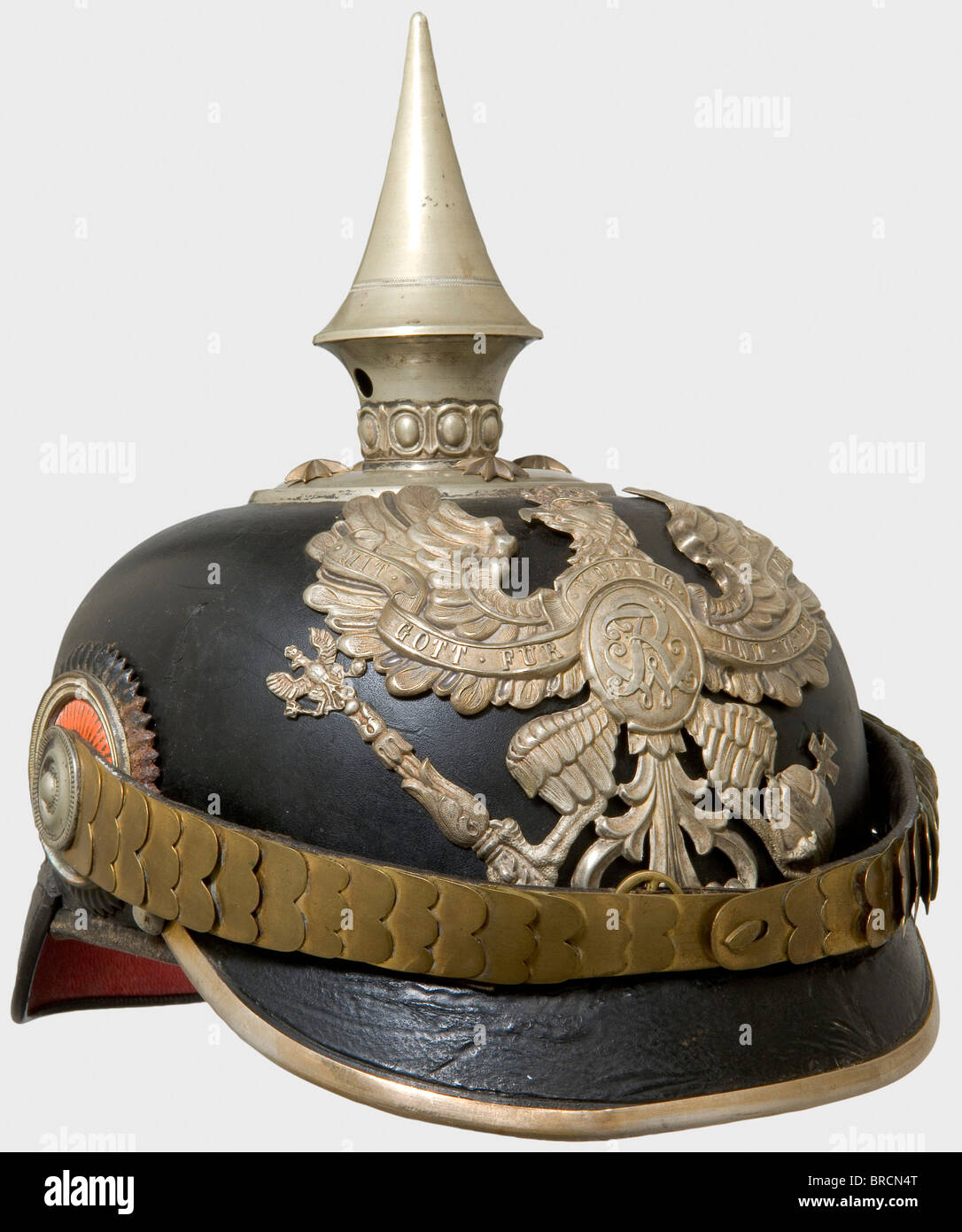 A helmet for officers, of the Pioneer Battalion Prince Radziwell (East Prussian) No. 1 Leather helmet body with silver fittings, old pattern grenadier eagle. Flat tombac chinscales, non-detachable spike, officer's cockades, brown silk liner. Varnished surface is dull and somewhat cracked. A rare helmet, worn only by a single Battalion. historic, historical, 19th century, Prussian, Prussia, German, Germany, militaria, military, object, objects, stills, clipping, clippings, cut out, cut-out, cut-outs, Stock Photo