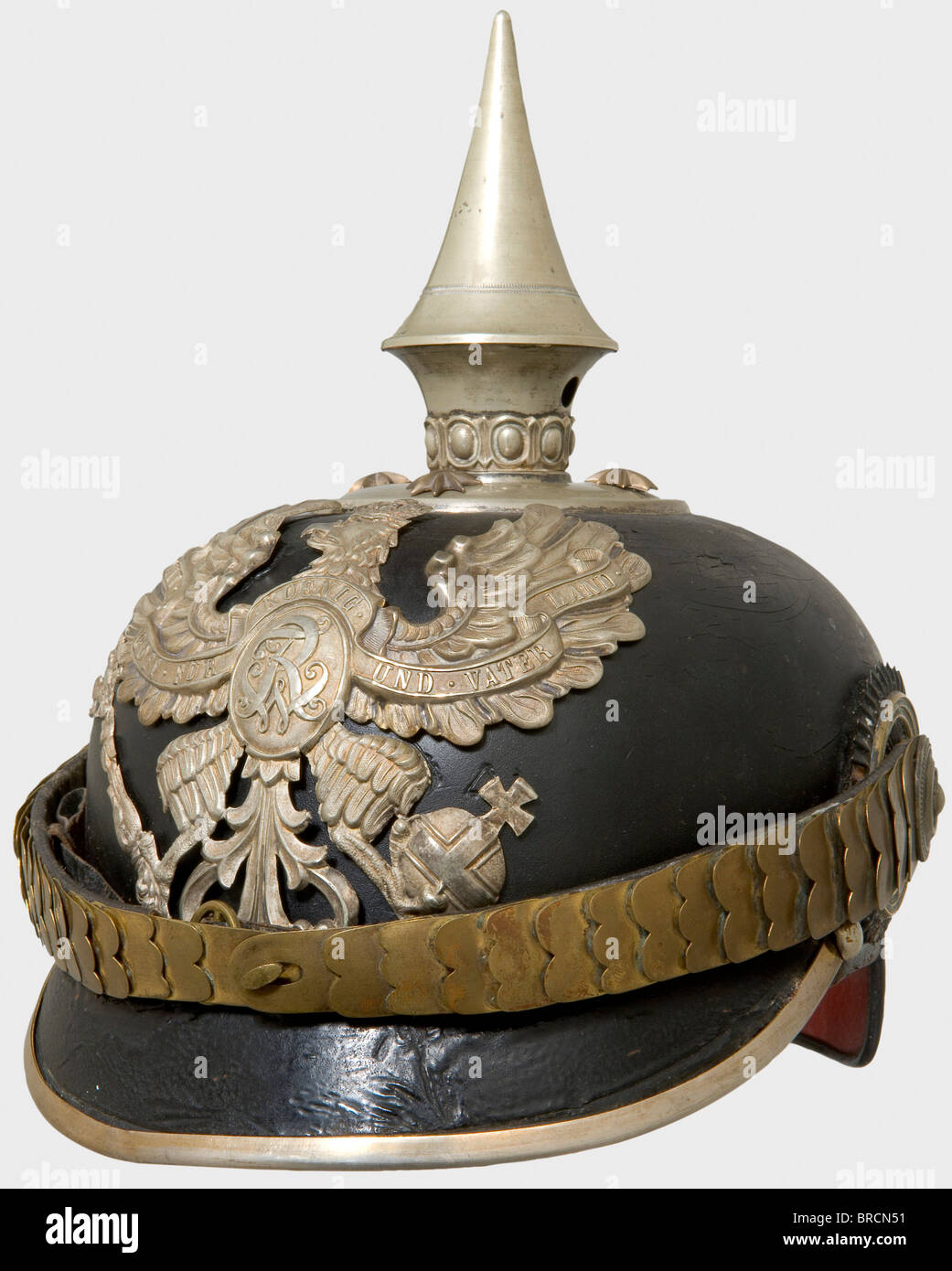 A helmet for officers, of the Pioneer Battalion Prince Radziwell (East Prussian) No. 1 Leather helmet body with silver fittings, old pattern grenadier eagle. Flat tombac chinscales, non-detachable spike, officer's cockades, brown silk liner. Varnished surface is dull and somewhat cracked. A rare helmet, worn only by a single Battalion. historic, historical, 19th century, Prussian, Prussia, German, Germany, militaria, military, object, objects, stills, clipping, clippings, cut out, cut-out, cut-outs, Stock Photo