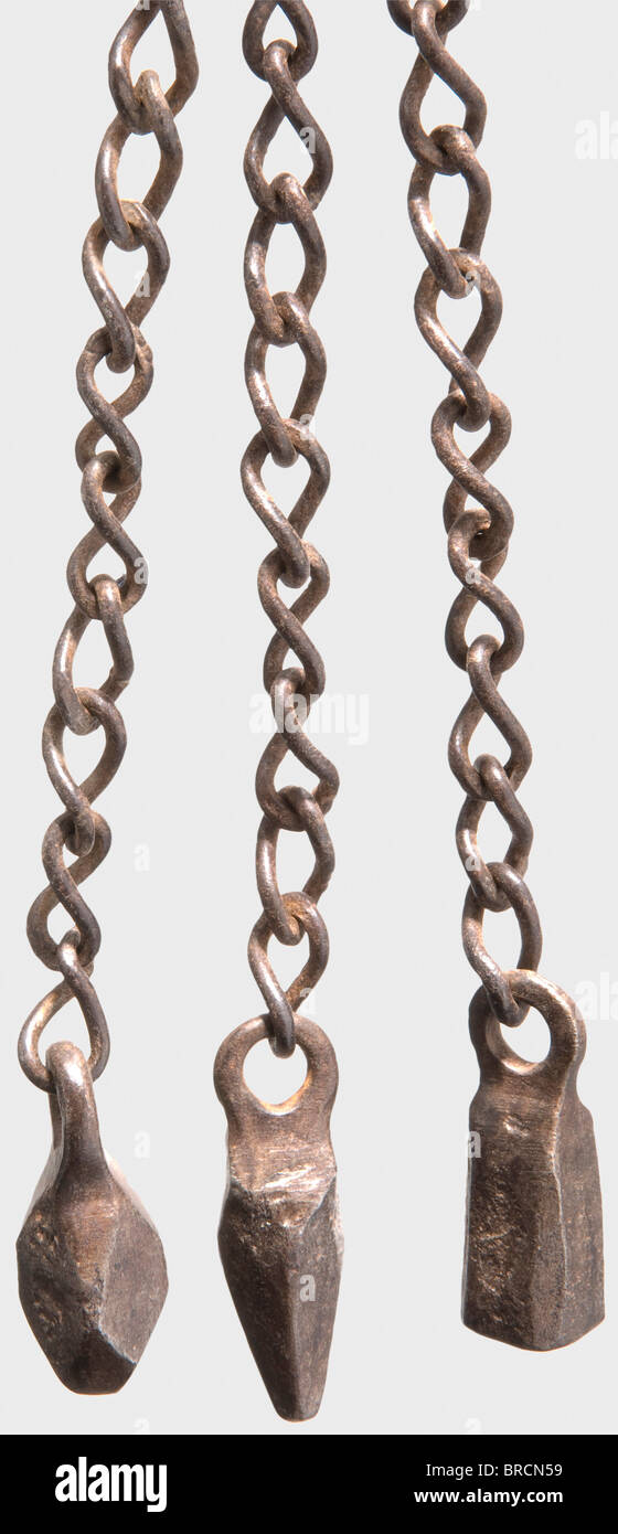 A German chain whip, 16th/17th century Three forged chains with variously shaped pendants attached to a rotatable eyelet on a sparingly cut iron nozzle. Turned wood shaft. Shaft length 56 cm, length of chains 42 cm. historic, historical,, 17th century, 16th century, instrument of torture, torture device, instruments of torture, torture devices, object, objects, stills, clipping, clippings, cut out, cut-out, cut-outs, Stock Photo