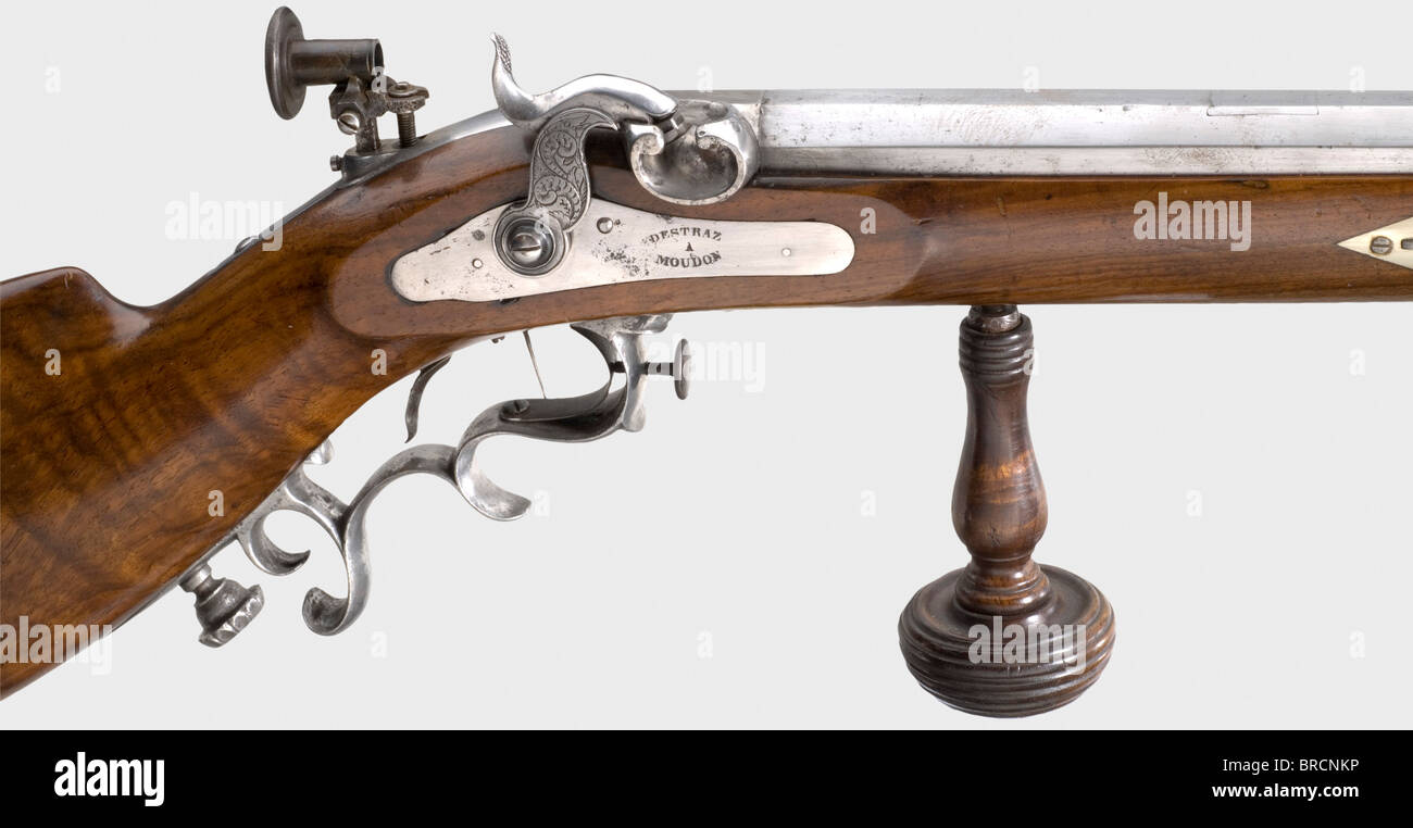 A percussion sporting rifle, Destraz, Moudon/CH, circa 1840. Heavy octagonal barrel with rifled bore in calibre 10.5 mm with patent breech-plug, bottom barrel rib and a re-filled rear sight dovetail notch. Dovetailed tube front sight with adaptable dioptre. Engraved percussion lock with hair trigger, bolt plate signed 'DESTRAZ A MOUDON'. Walnut half stock with iron fittings and detachable wooden palm rest. Wooden ramrod replaced. Length 132 cm. historic, historical, 19th century, civil long guns, gun, weapons, arms, weapon, arm, firearm, fire arm, gun, fire arm, Stock Photo
