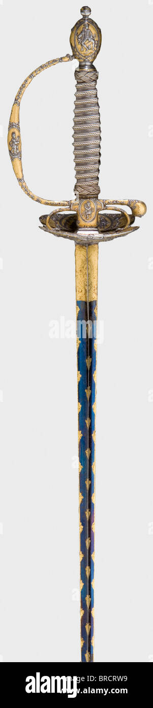 A fine French gilt court-sword with chiselled hilt, circa 1780 A triangular thrusting blade, blued for its entire length on both sides and decorated with gilt fleur-de-lys. Gilt French coat of arms under a royal crown on both sides at the forte. A chiselled hilt lavishly decorated in relief with riders, soldiers, and military scenes against a stippled background. Original corded silver wire grip cover and Turk's heads. The wooden scabbard (partially restored) is covered with sharkskin and has a finely cut, gilt locket. The chape and suspension bar are old, but , Stock Photo