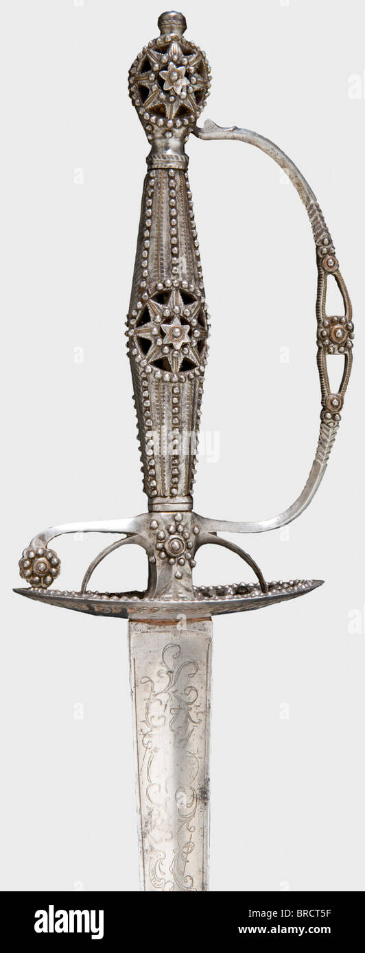 A French iron small-sword, circa 1790 A tapering hollow triangular blade etched with floral decoration at the forte. Openwork, chiselled iron hilt, profusely applied with facetted steel beads in imitation of brilliants. Length 102.5 cm. historic, historical, 18th century, dress sword, swords, thrusting, thrustings, smallsword, epee de cour, weapon, arms, weapons, arms, military, militaria, object, objects, stills, clipping, clippings, cut out, cut-out, cut-outs, Stock Photo
