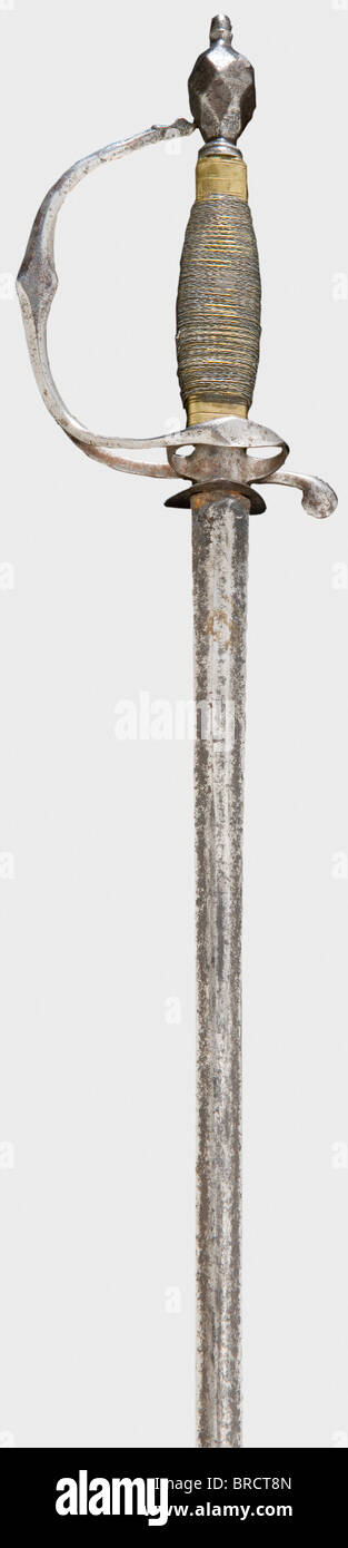 An iron small-sword, England(?), circa 1785 Double-edged thrusting blade of flattened hexagonal section and a reduced, faceted, knuckle-guard hilt. Later iron and brass wire grip covering. Length 82.5 cm. historic, historical, 18th century, dress sword, swords, thrusting, thrustings, smallsword, epee de cour, weapon, arms, weapons, arms, military, militaria, object, objects, stills, clipping, clippings, cut out, cut-out, cut-outs, Stock Photo