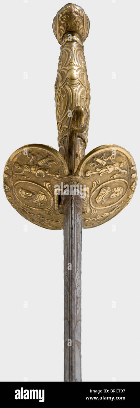 A French small-sword, circa 1740 A double-edged thrusting blade of flattened hexagonal section and well preserved etching on both sides of the forte. An all-brass hilt chiselled in relief with cartouches amid geniis. Length 90 cm. Well-preserved, elegant sword. historic, historical, 18th century, dress sword, swords, thrusting, thrustings, smallsword, epee de cour, weapon, arms, weapons, arms, military, militaria, object, objects, stills, clipping, clippings, cut out, cut-out, cut-outs, Stock Photo