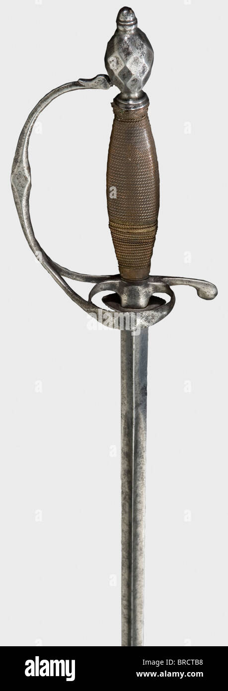 An iron small-sword, Central Europe, circa 1790 Thrusting blade of hollow triangular section with a reduced iron hilt. Quillons and pommel show faceted, lozenge-shaped decoration. Somewhat damaged copper wire winding and Turk's head. Length 97 cm. historic, historical, 18th century, dress sword, swords, thrusting, thrustings, smallsword, epee de cour, weapon, arms, weapons, arms, military, militaria, object, objects, stills, clipping, clippings, cut out, cut-out, cut-outs, Stock Photo