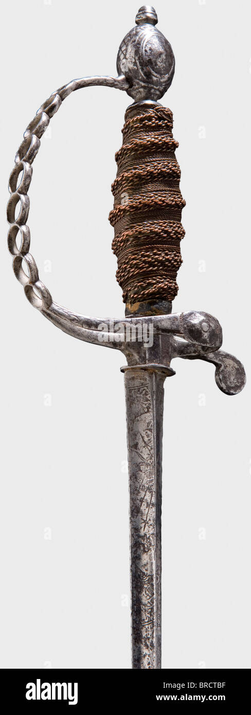 A French iron small-sword, circa 1790 Triangular (somewhat corroded) thrusting blade etched with trophies at the forte. Reduced chiselled iron hilt, the knuckle-bow with ring-shaped perforations. Lavish copper wire grip winding with one Turk's head. Length 86.5 cm. historic, historical, 18th century, dress sword, swords, thrusting, thrustings, smallsword, epee de cour, weapon, arms, weapons, arms, military, militaria, object, objects, stills, clipping, clippings, cut out, cut-out, cut-outs, Stock Photo
