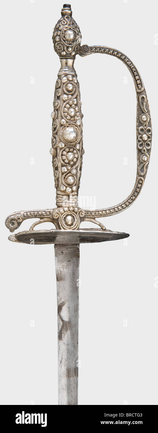A French silver-hilted small-sword, circa 1790 Smooth, slender triangular blade. Silver hilt cut in a lozenge pattern with vine decoration and several silver hallmarks on the grip and finger loop. Length 99.5 cm. historic, historical, 18th century, dress sword, swords, thrusting, thrustings, smallsword, epee de cour, weapon, arms, weapons, arms, military, militaria, object, objects, stills, clipping, clippings, cut out, cut-out, cut-outs, Stock Photo