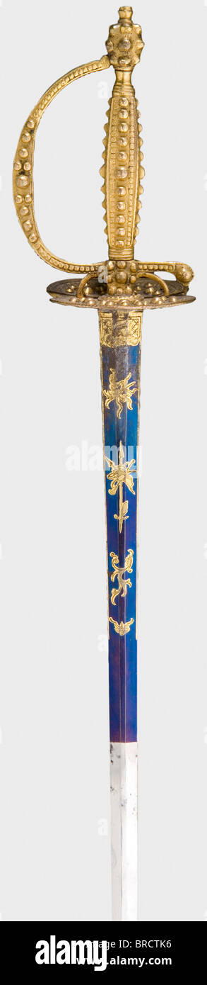 A French small-sword with gold-plated hilt and scabbard, circa 1790 Double-edged blade of flattened hexagonal section and well preserved bluing and gilding on the upper third. Gilt knuckle-bow hilt with faceted bead decoration. Later, lacquered scabbard with gilt locket and chape. Length 105 cm. historic, historical, 18th century, dress sword, swords, thrusting, thrustings, smallsword, epee de cour, weapon, arms, weapons, arms, military, militaria, object, objects, stills, clipping, clippings, cut out, cut-out, cut-outs, Stock Photo