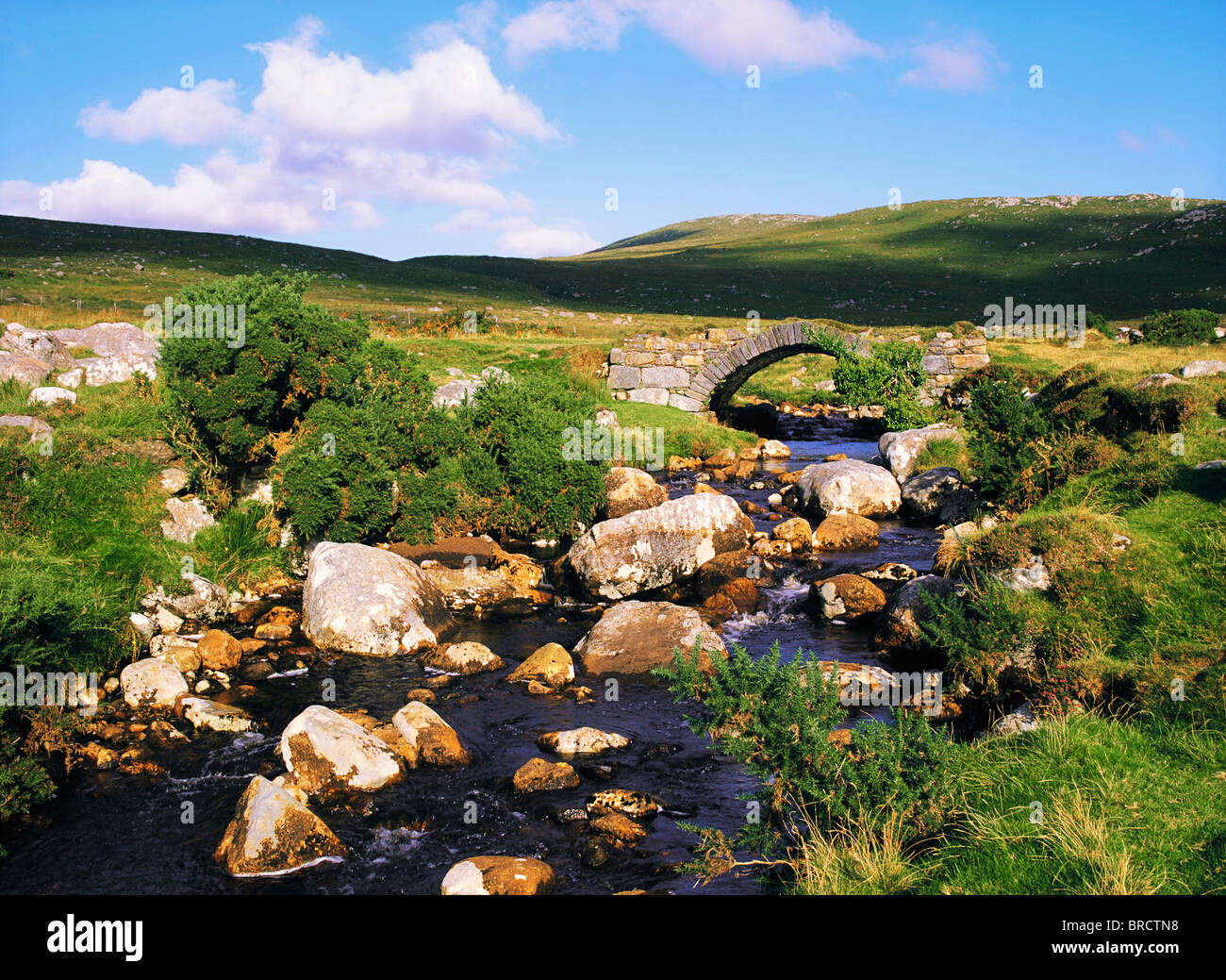 Poisoned Glen, Co Donegal, Ireland; River Passing Under A Stone Bridge Stock Photo