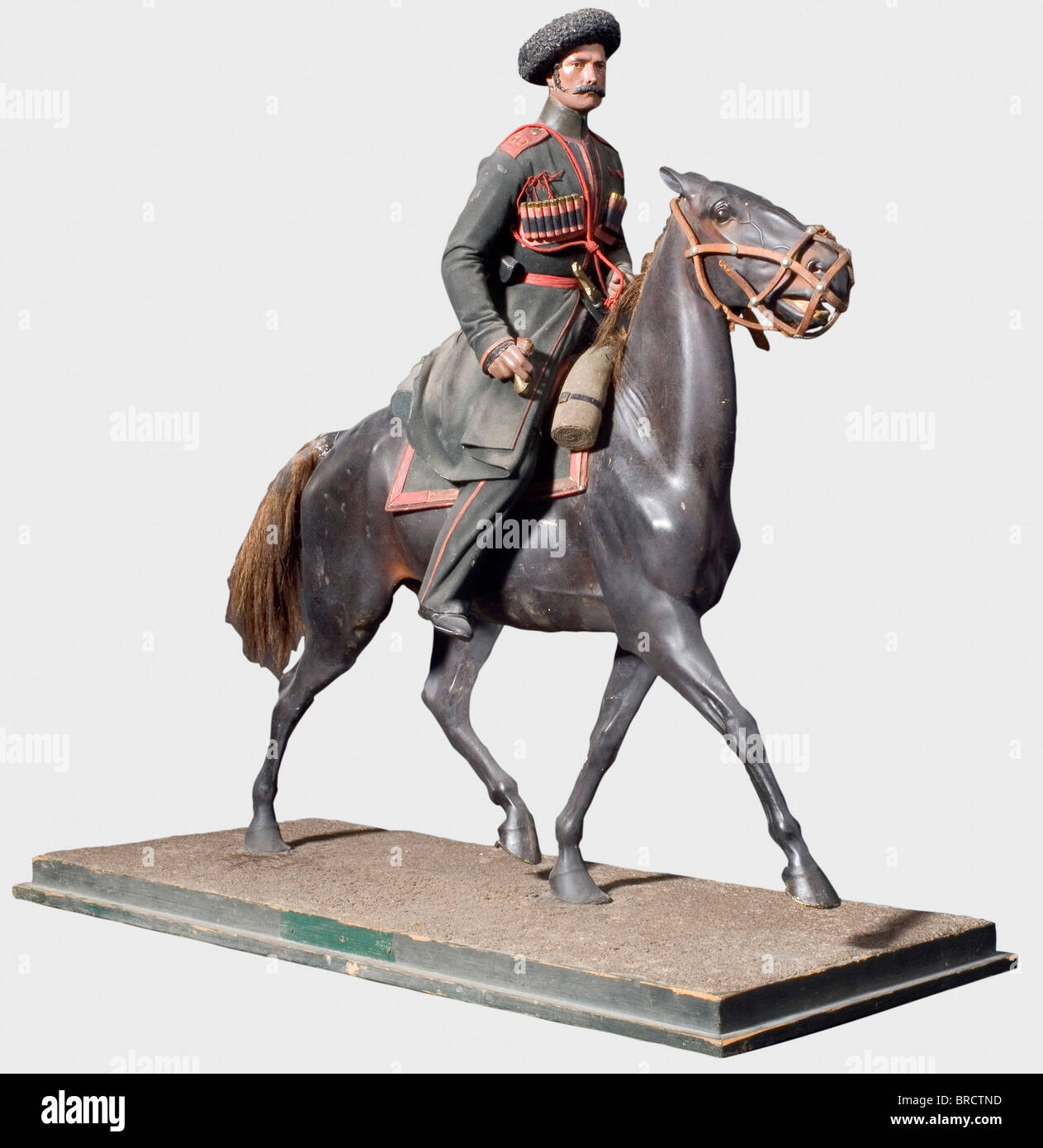 A model of a Cossack of the Caucasian Corps, Wilhelm Haasenberger, St. Petersburg, circa 1844 Plaster of Paris, hollow casting, coloured, leather, metals, horsehair and wood. Exceedingly detailed and natural presentation of a Cossack and his horse. Complete with saddlecloth, cartridge box, kinjal, pistol and mundir with gazyri on his chest. Blemishes on strapping and bridle, shashqa missing. Repaired due to old age. Height 69 cm. O historic, historical, people, 19th century, sculpture, sculptures, statuette, figurine, figurines, statuettes, fine arts, art, man,, Stock Photo