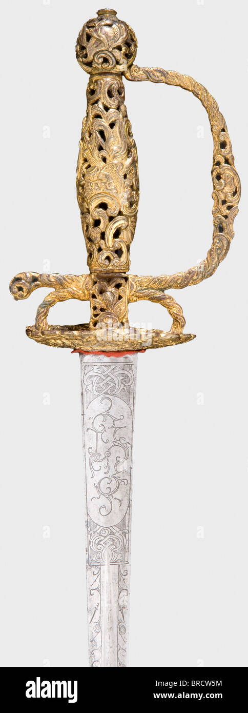 A French small-sword with gold-plated hilt, circa 1760 Hollow triangular blade with ornamental etching at the forte. Openwork, gold-plated brass hilt with interlaced rocaille and trophy decoration. Gilding somewhat rubbed. Length 95 cm. historic, historical, 18th century, dress sword, swords, thrusting, thrustings, smallsword, epee de cour, weapon, arms, weapons, arms, military, militaria, object, objects, stills, clipping, clippings, cut out, cut-out, cut-outs, Stock Photo
