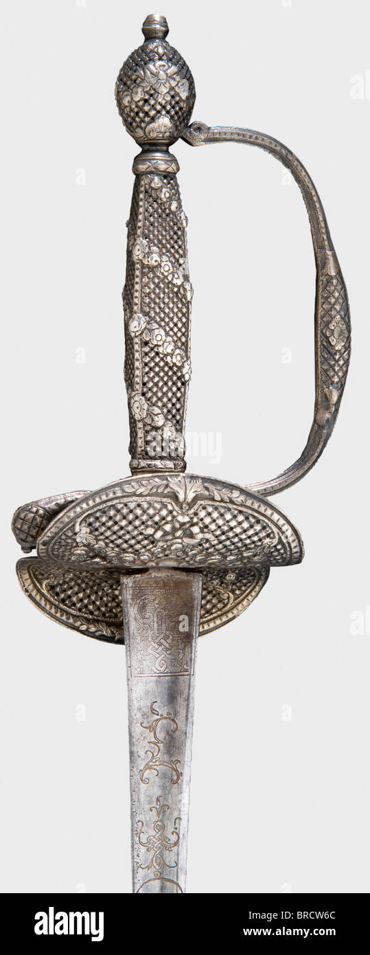 A French silver-hilted small-sword, Paris, circa 1790 Triangular thrusting blade with remnants of gilt metaphorical and ornamental etching at the forte. Fine openwork silver hilt with delicate floral relief and an S-shaped double guard. Hallmark on the arms of the hilt. Length 88.5 cm. historic, historical, 18th century, dress sword, swords, thrusting, thrustings, smallsword, epee de cour, weapon, arms, weapons, arms, military, militaria, object, objects, stills, clipping, clippings, cut out, cut-out, cut-outs, Stock Photo
