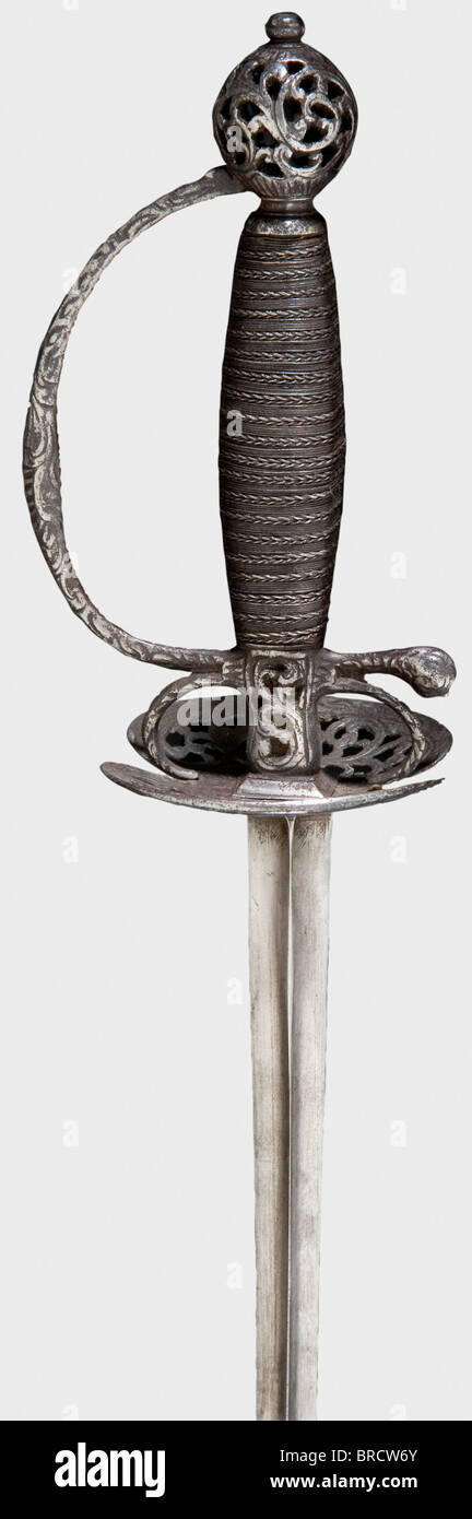 A French small-sword with chiselled hilt, circa 1780 Smooth triangular blade with an openwork iron hilt chiselled with tendril patterns. Twisted iron wire-bound grip without Turk's heads. Length 87.5 cm. historic, historical, 18th century, dress sword, swords, thrusting, thrustings, smallsword, epee de cour, weapon, arms, weapons, arms, military, militaria, object, objects, stills, clipping, clippings, cut out, cut-out, cut-outs, Stock Photo