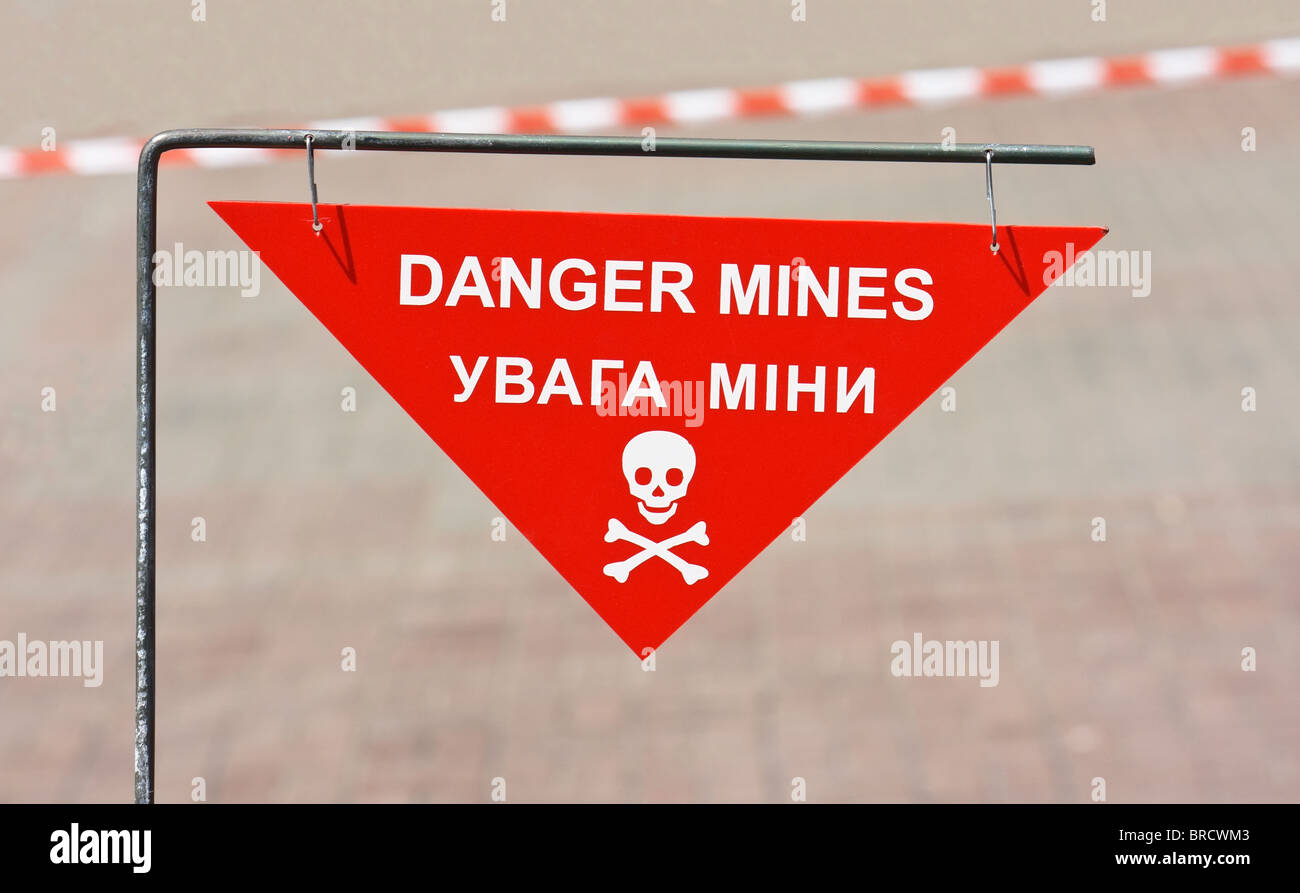 Warning sign on mined area in the city street Stock Photo
