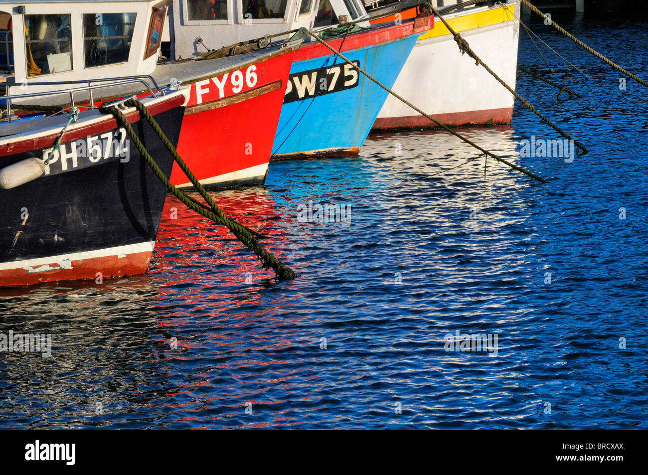 Colourful fishing boats in harbour Stock Photo