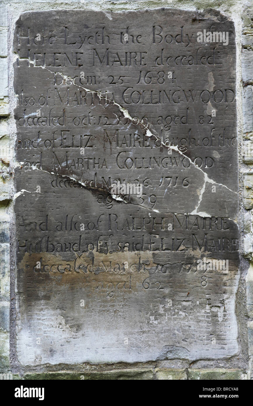 A cracked gravestone in the churchyard of St Margaret's in Durham